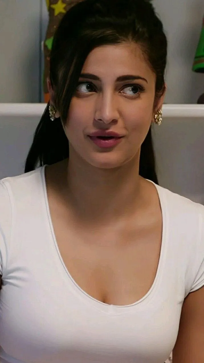 Shruti Haasan wearing a casual white top with a charming expression