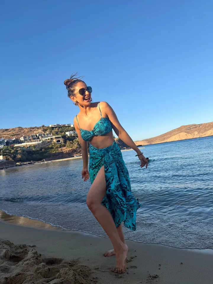 Rakul Preet Singh showcasing chic beachwear accessories and matching wrap skirt