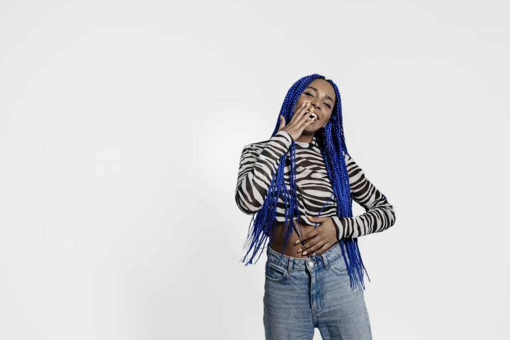 woman with blue hair laughing