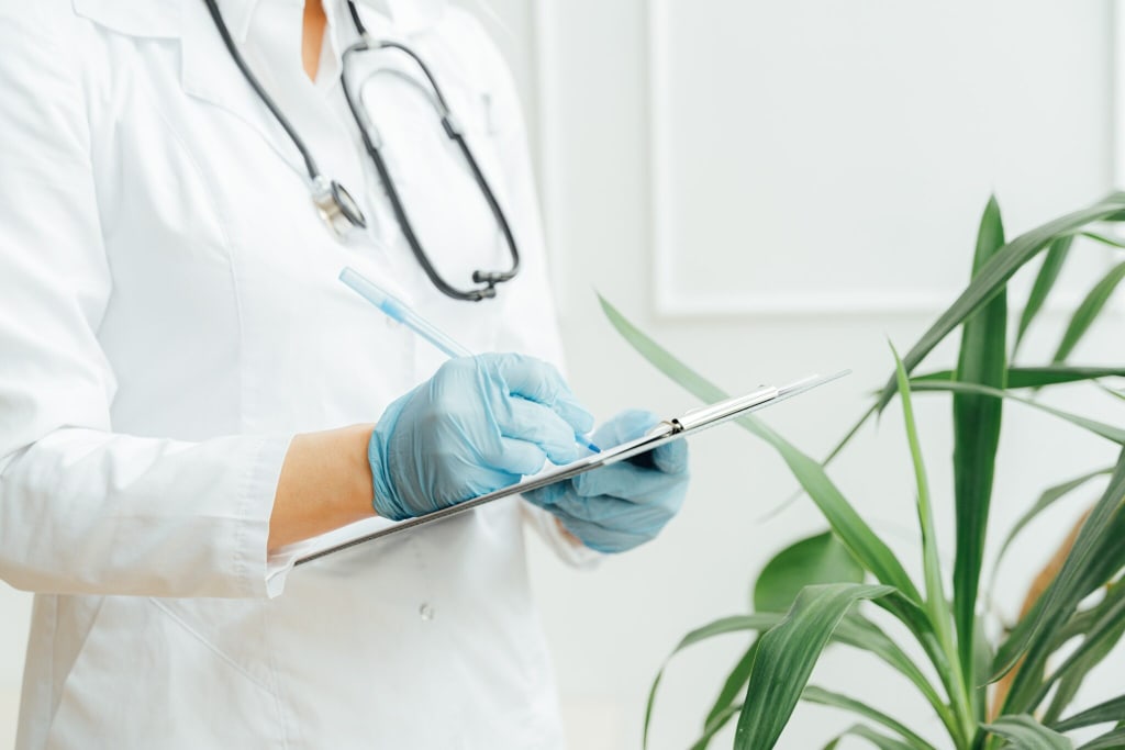 Medical professional filling out form