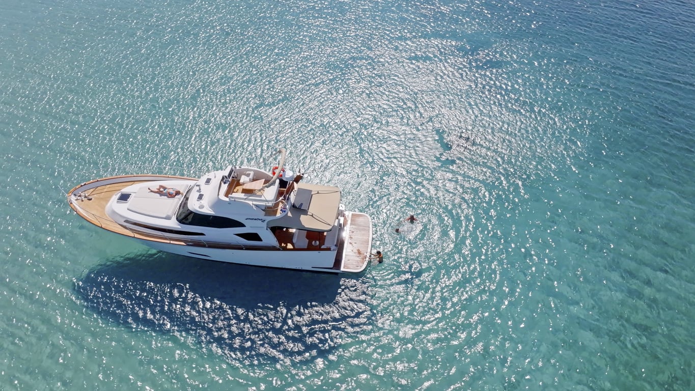 Aerial view of family swimming and sunbathing in Adriatic Sea during vacation.