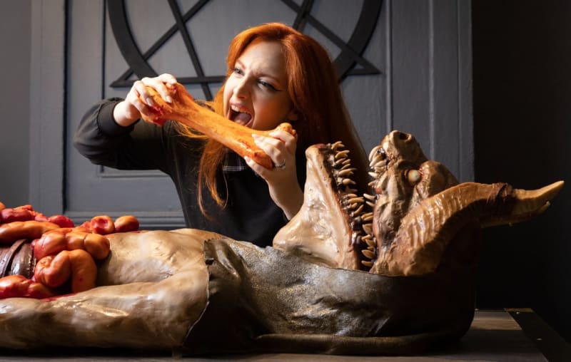 Lady eating a demon chocolate — Lilith & Co