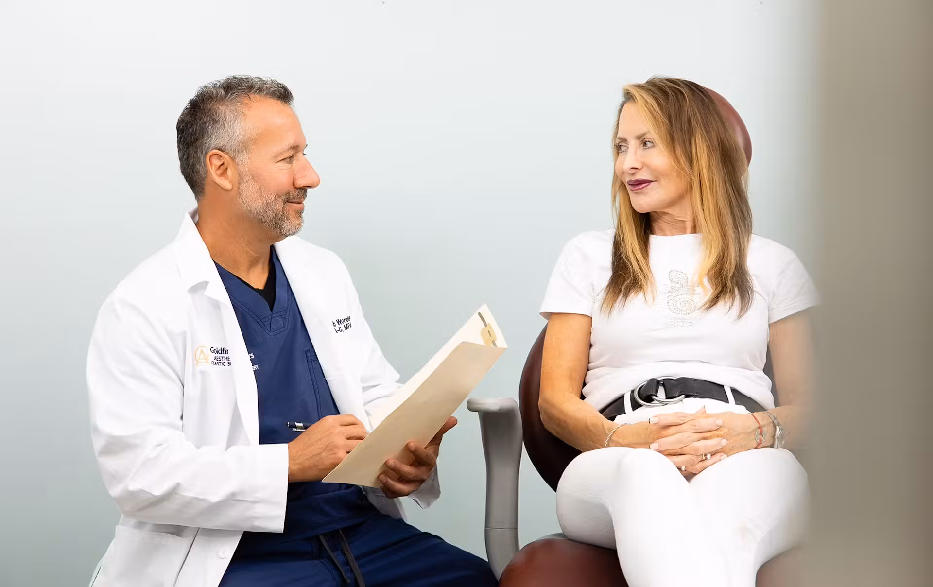 Doctor going over file with patient
