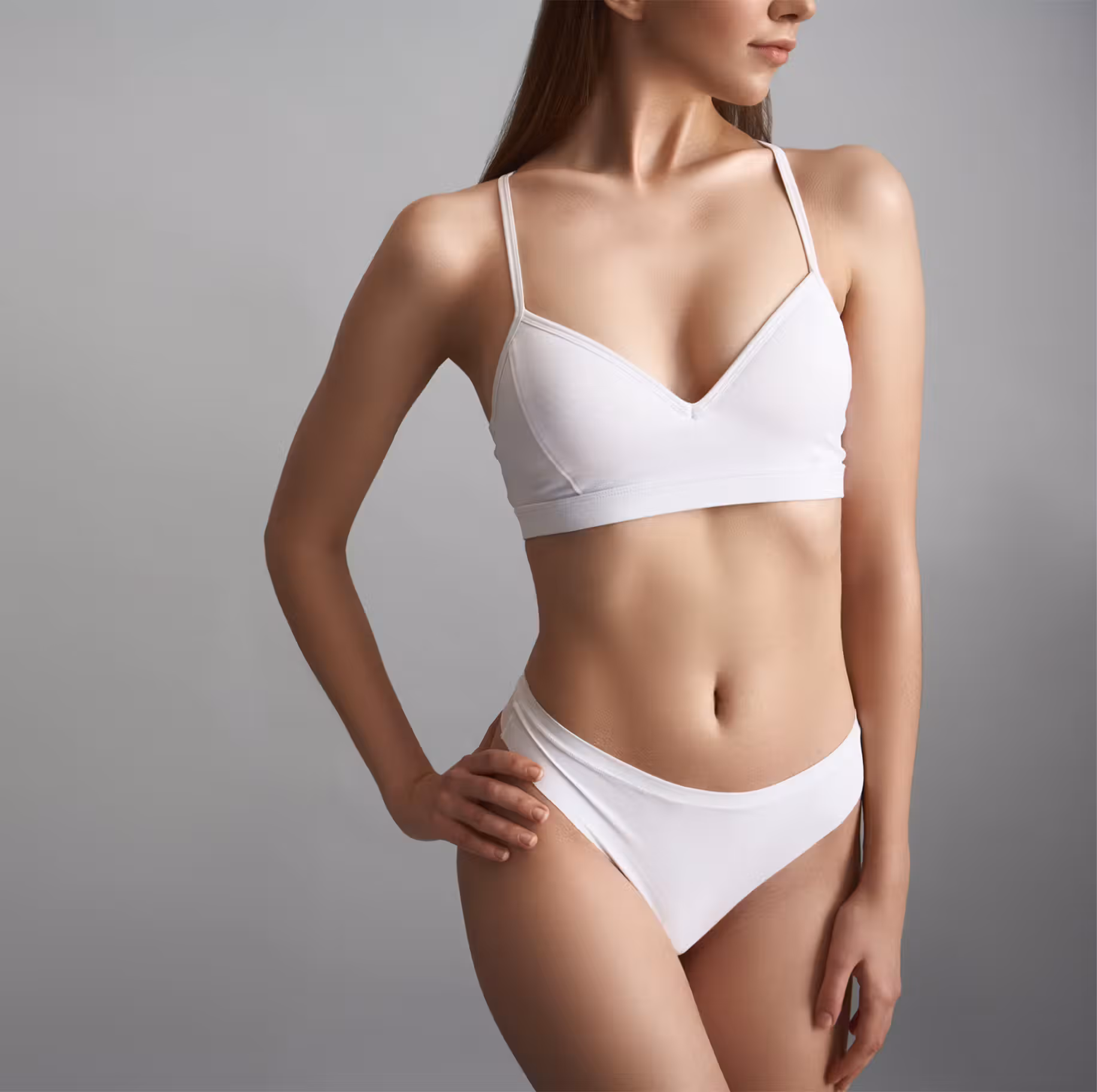 doctor placing hands on womans stomach