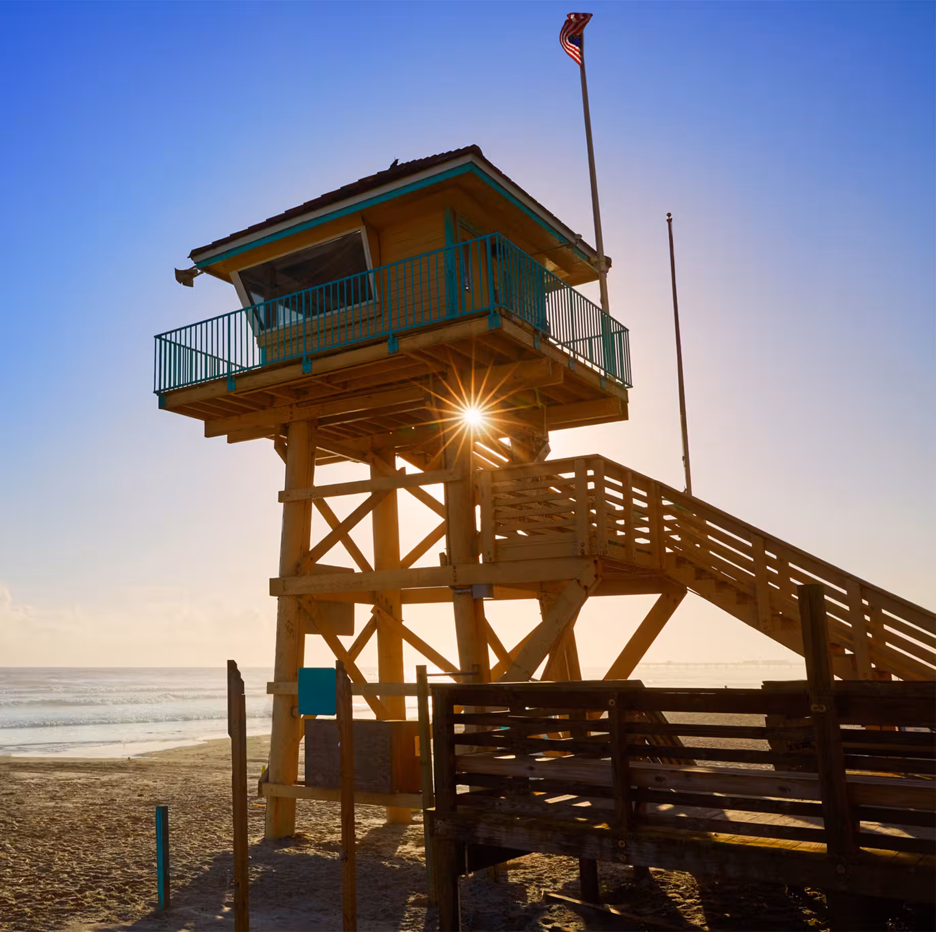 lifeguard tower at sunset