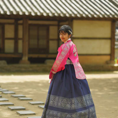 Dee in hanbok at a traditional Korean courtyard