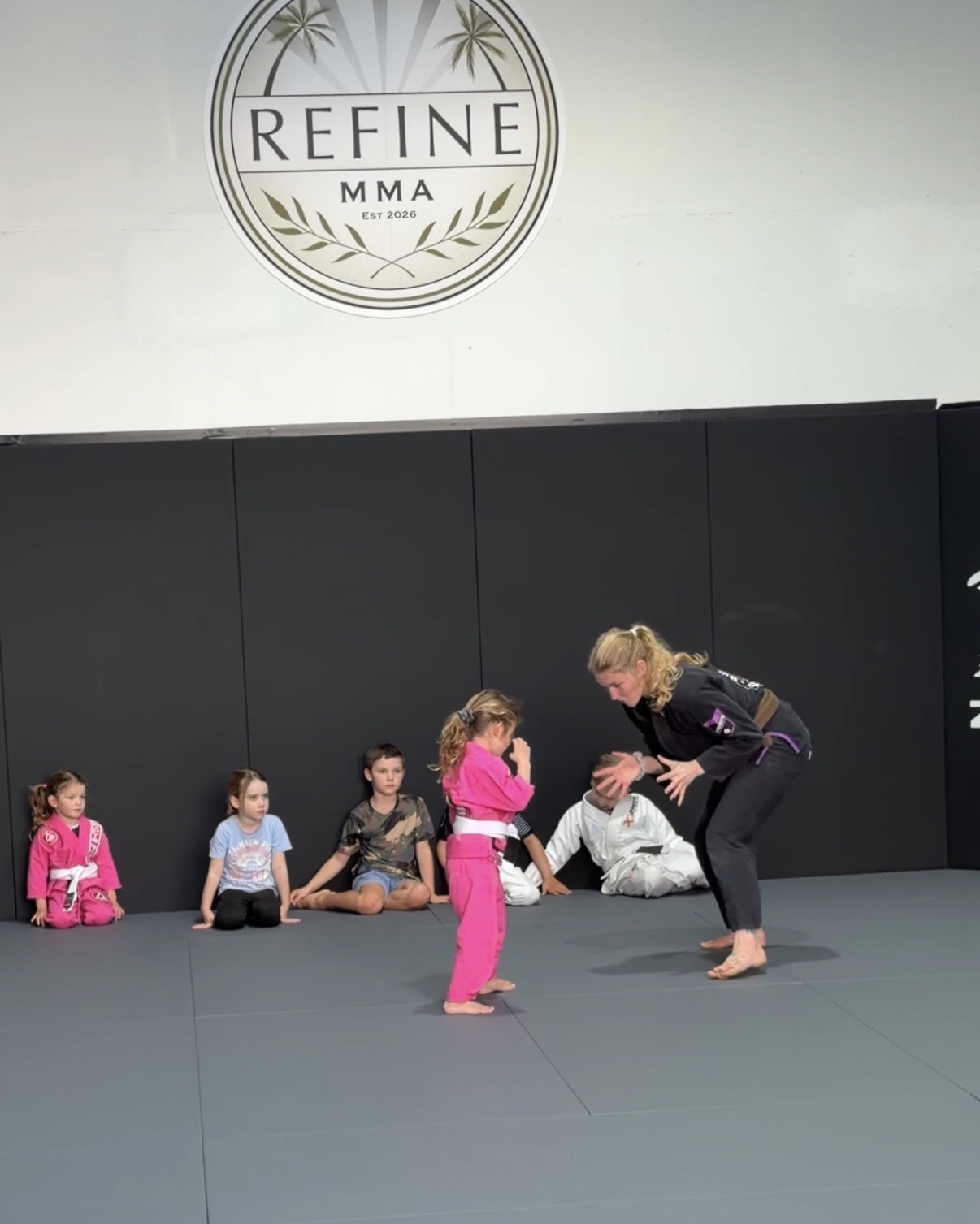 Kids training Brazilian jiu-jitsu at Refine MMA
