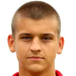 Adam Dźwigaładisparo a la cabeza