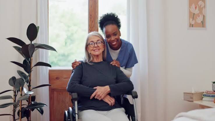 Carer supporting client at home