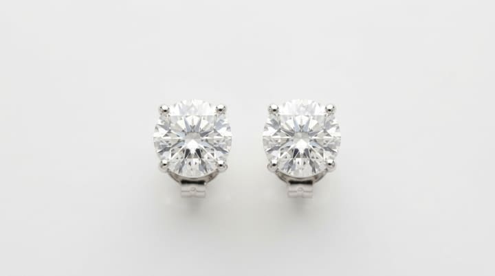 Diamond stud earrings with bright facet reflection for match and quality review