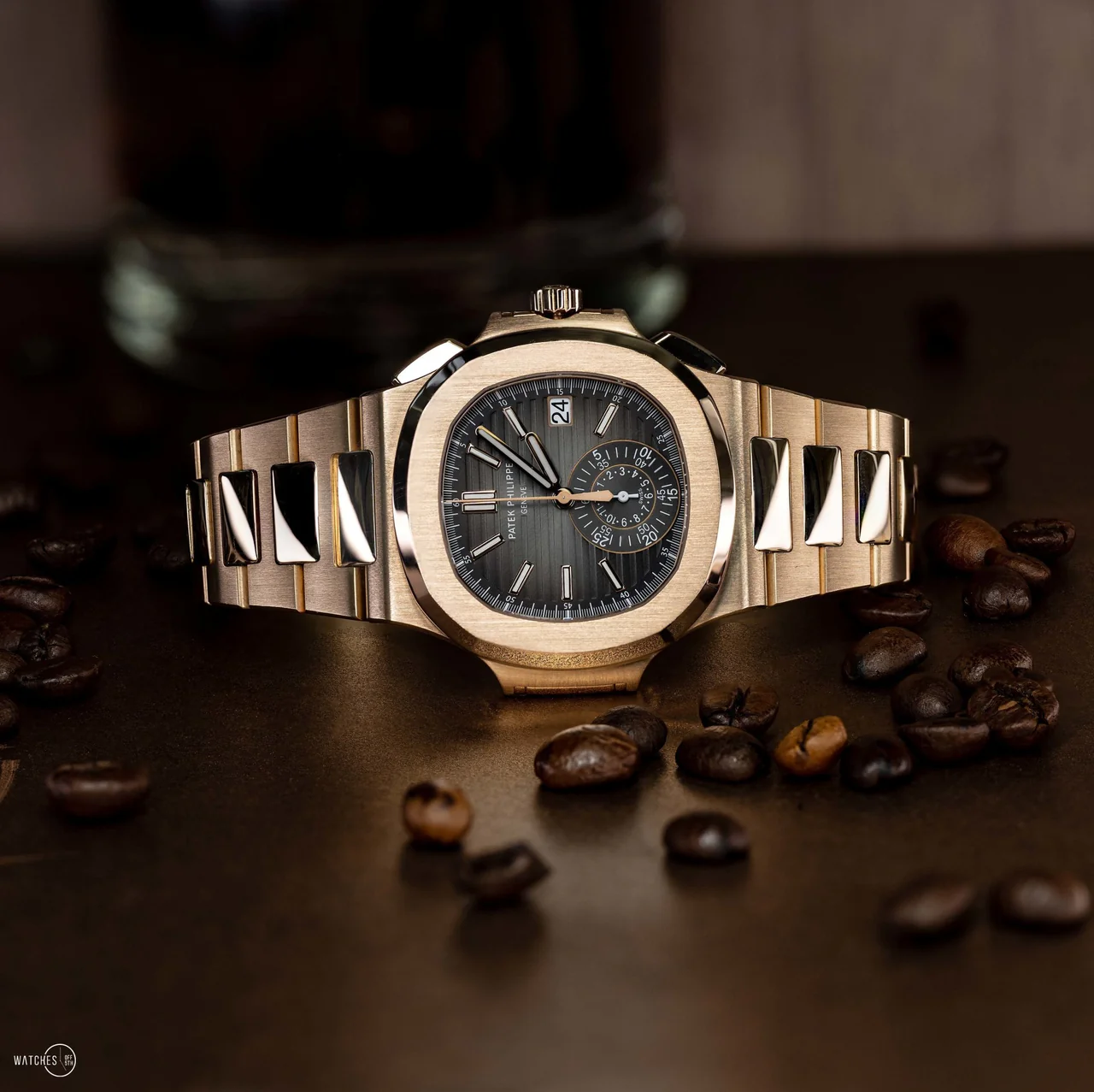 Patek Philippe Nautilus rose gold on textured wood at golden hour