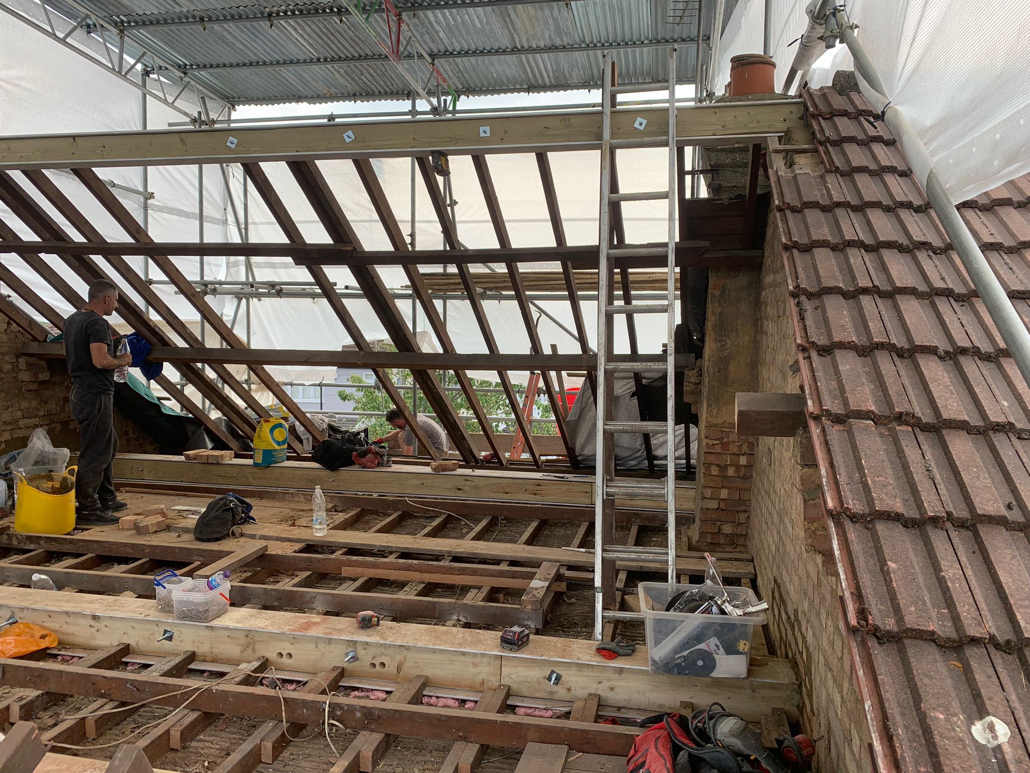 Roofing installation with new tiles