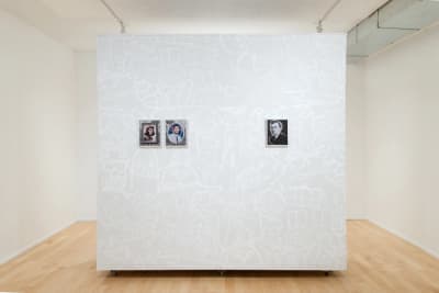 Gallery documentation of a solo exhibition of colour photos and wall paintings