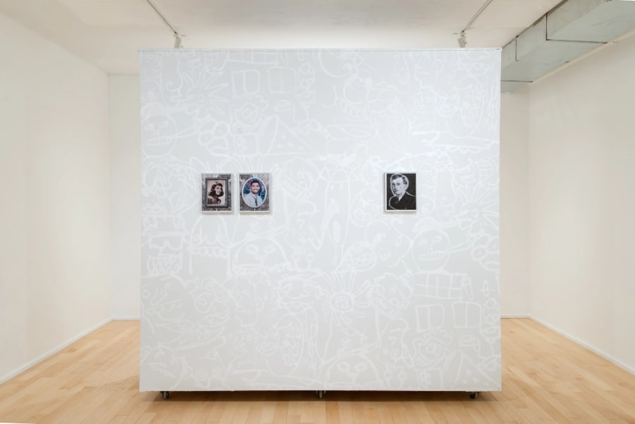 Gallery documentation of a solo exhibition of colour photos and wall paintings