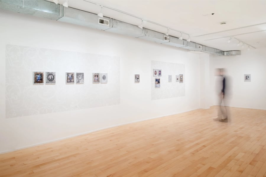 Gallery documentation of a solo exhibition of colour photos and wall paintings
