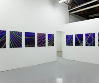 Image of a painting exhibition installed in an art gallery.