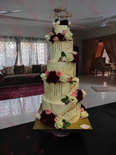 Multi Tier Wedding Cake with Gold Drip and Flowers Islamabad
