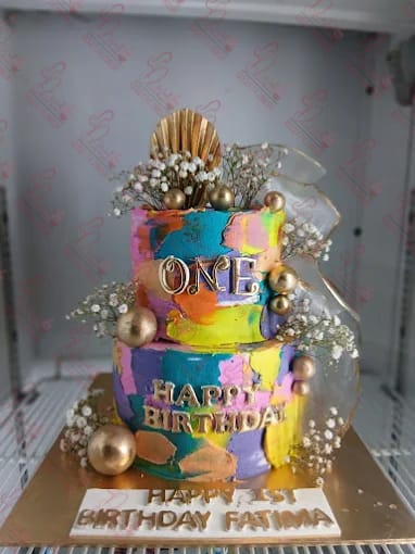 Vibrant Two Tier Baby Girl Cake Faisalabad