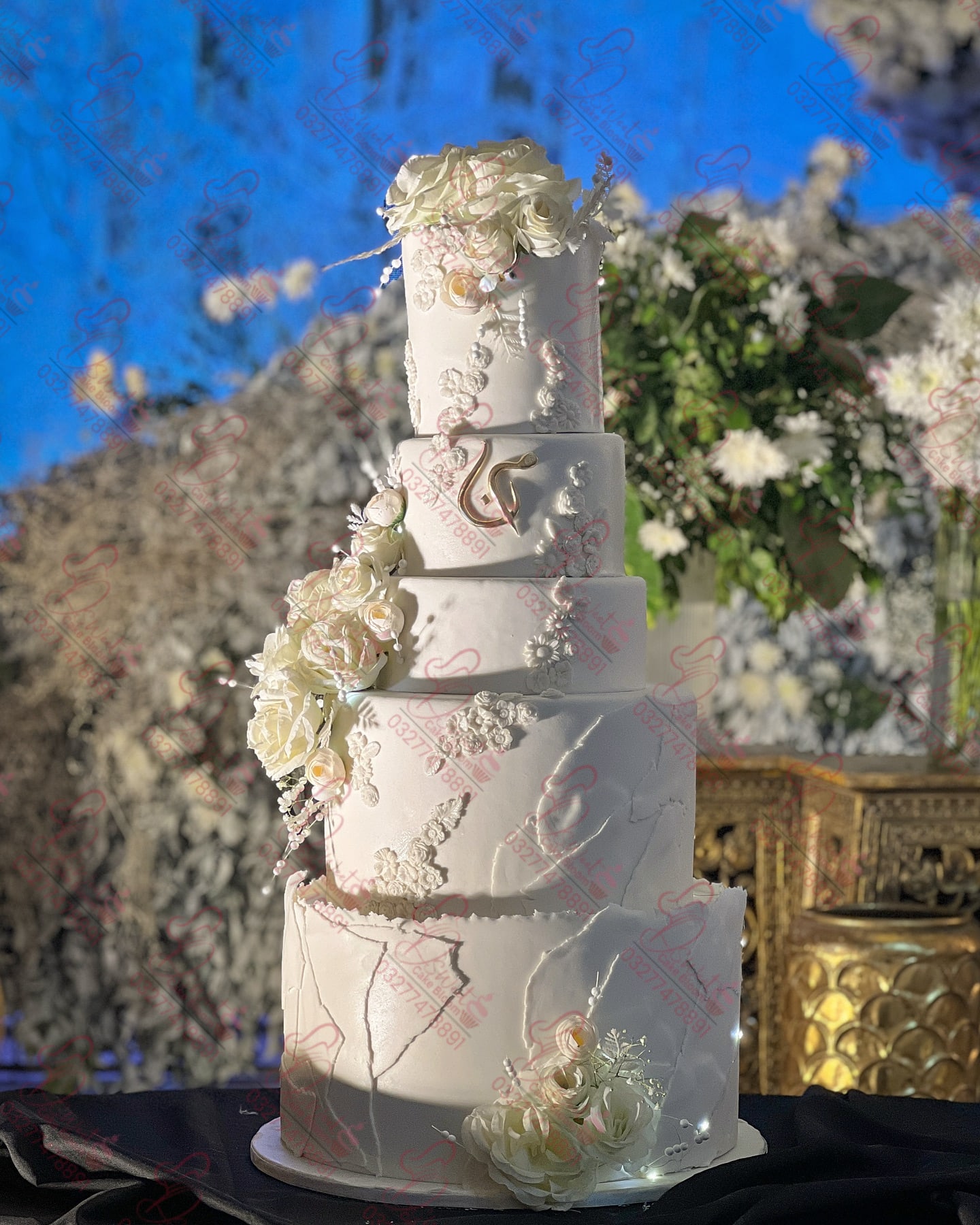 Multi Tier White Wedding Cake with White Flowers Rawalpindi