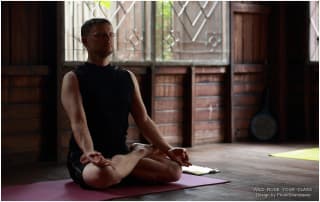 Do Less, Feel More: Yoga teacher Gernot Huber in Padmasana