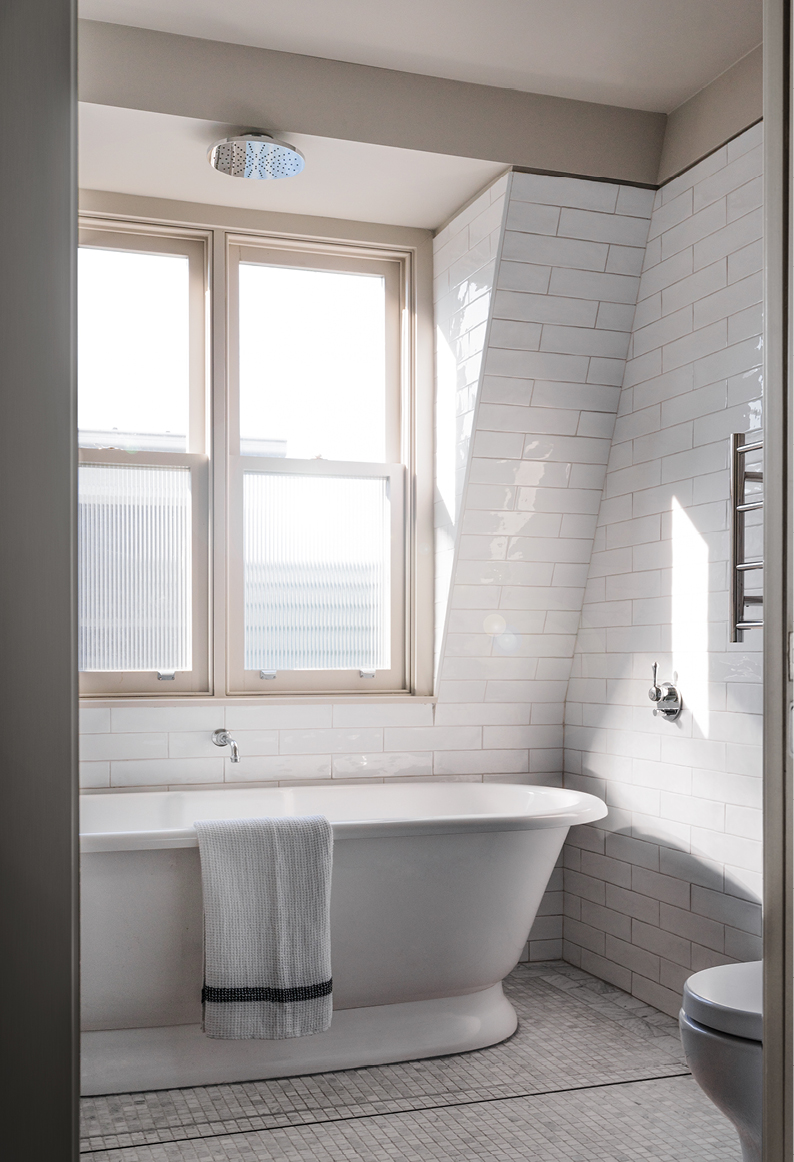 Bathroom woith attic style windows