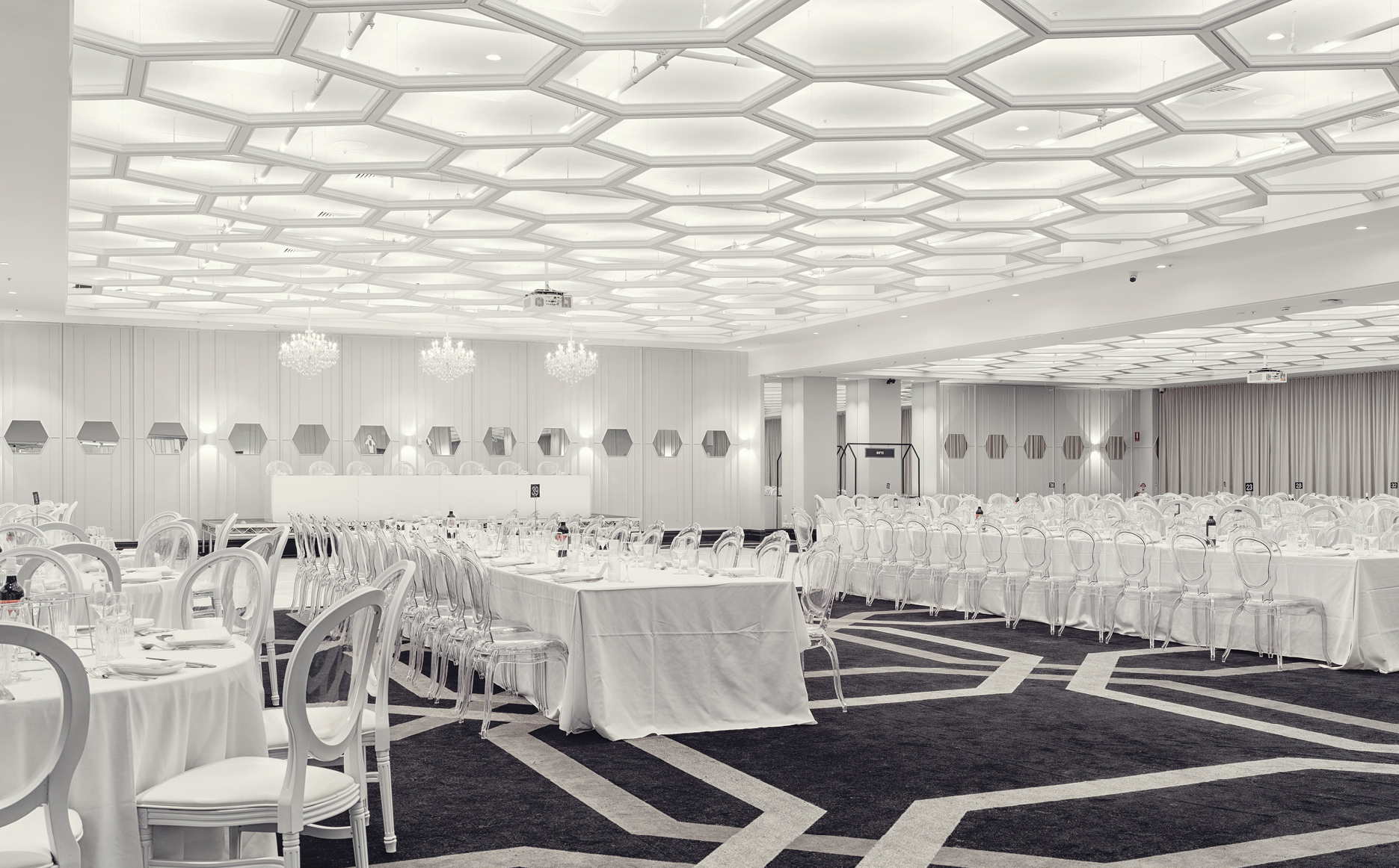 Colosseo Room with suspended geometric ceiling lighting inside Club Marconi