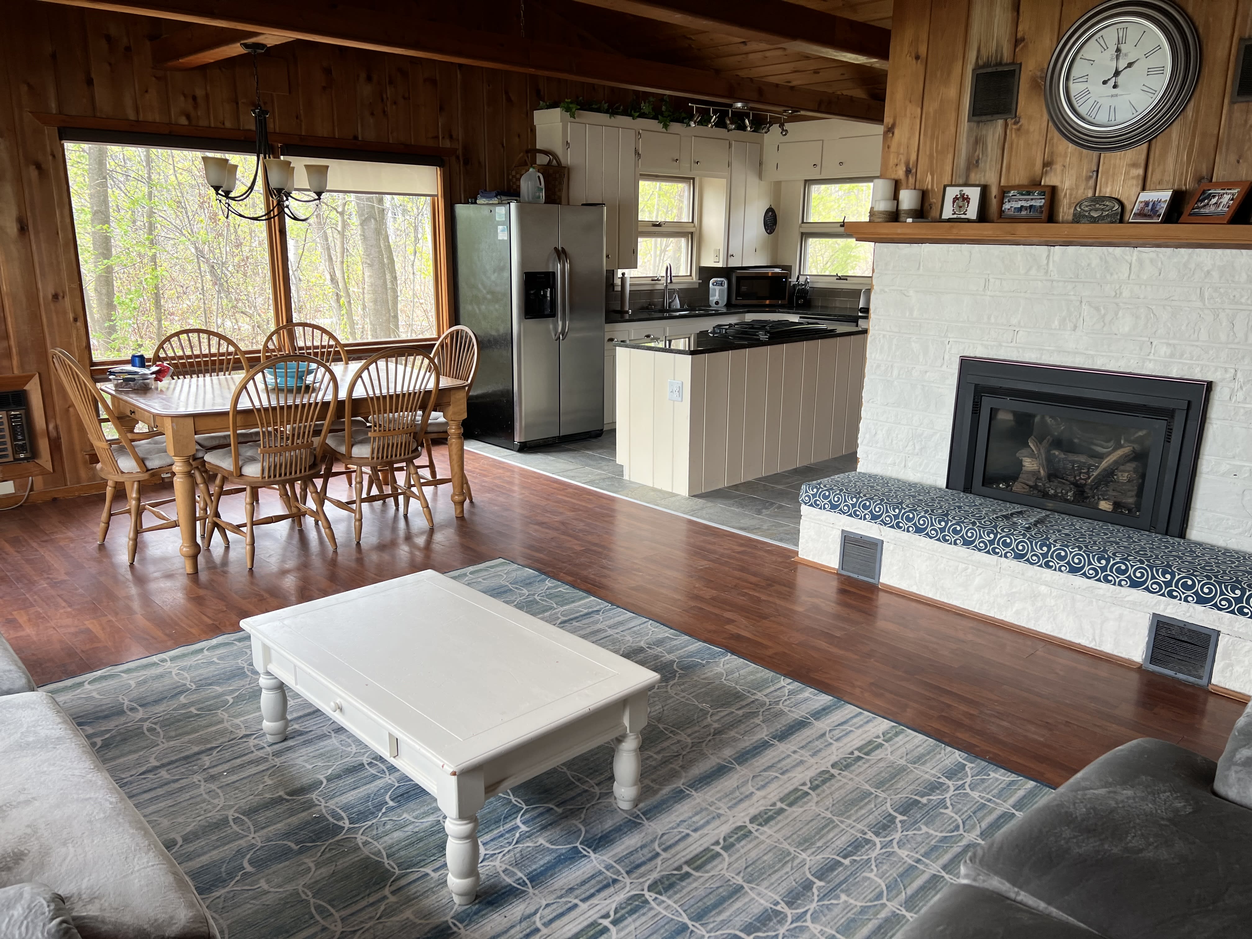 Living room with fireplace and kitchen