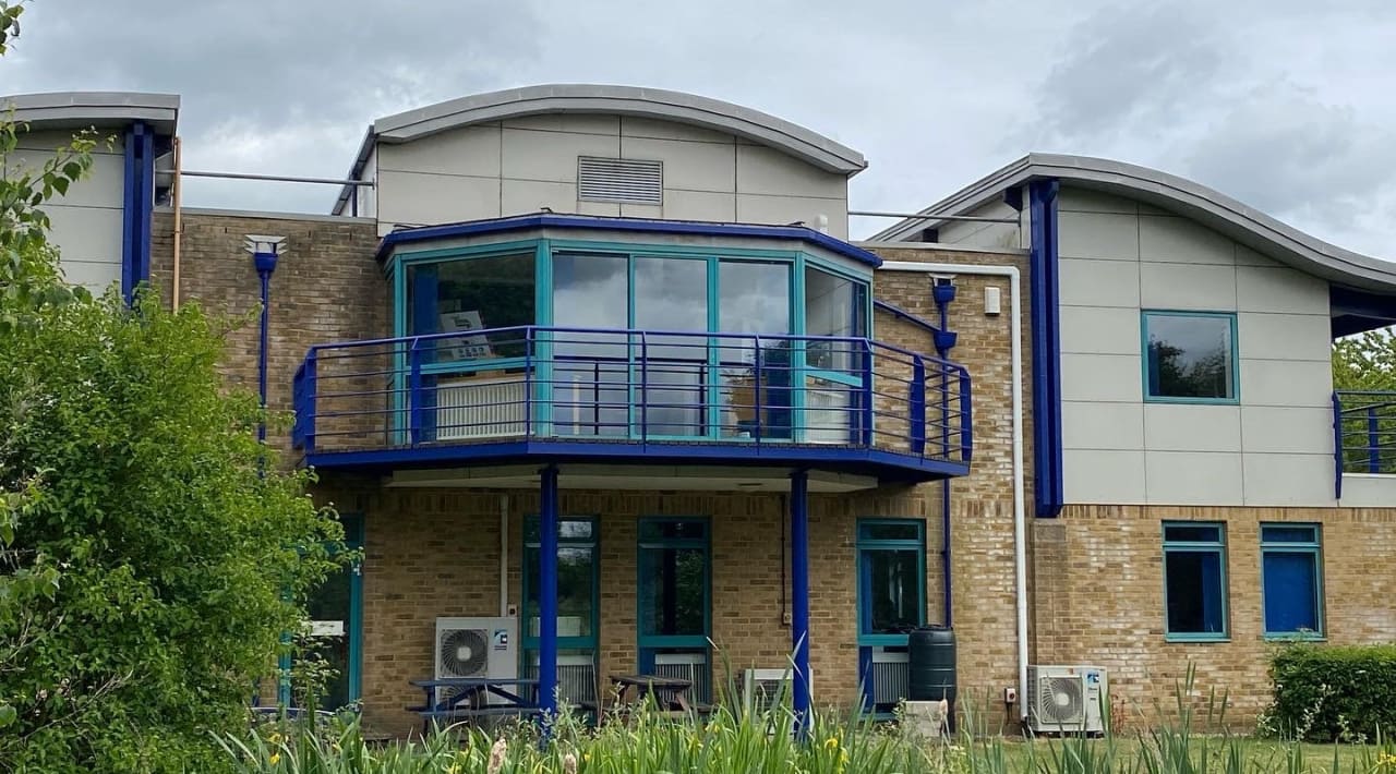 Completed office block in its new bright blue scheme.
