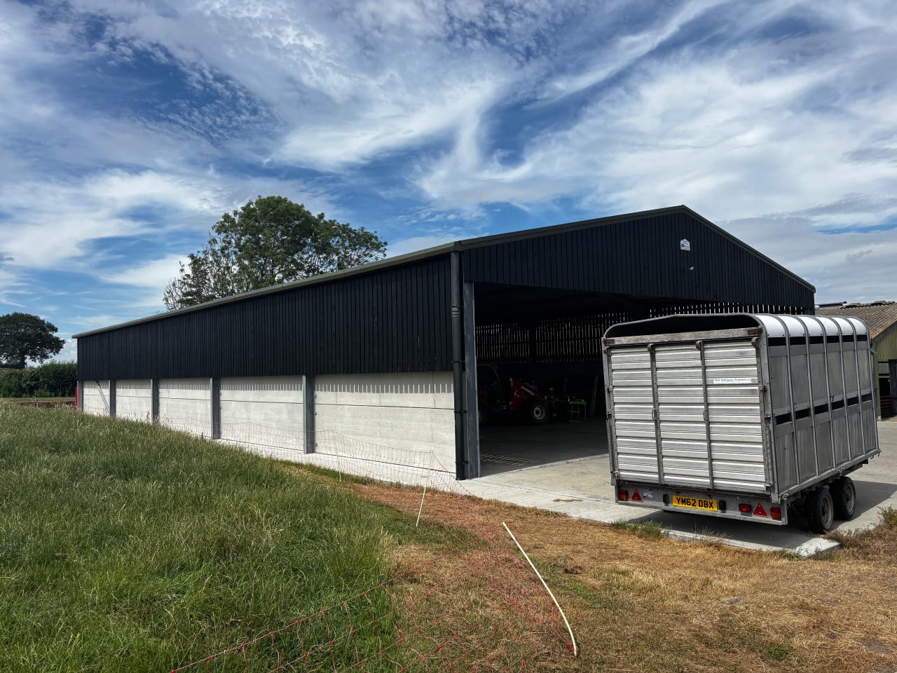 Completed timber barn cladding after repainting, Flowton, Suffolk.