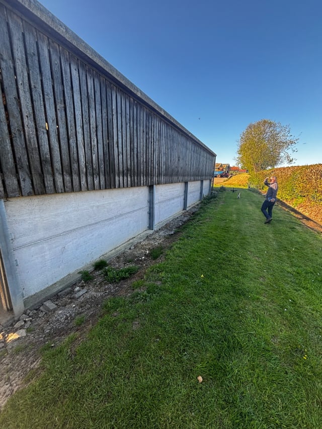 Existing cladding recorded before preparation.