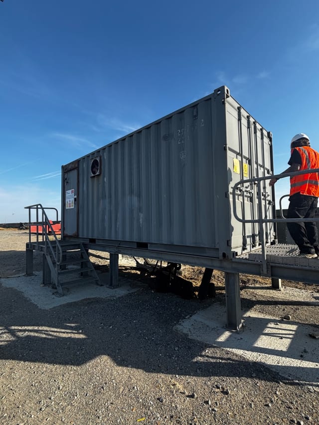 Corroded container cladding before pressure washing and preparation.