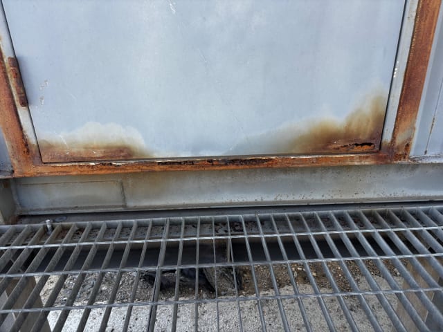 Surface corrosion on the container framework.