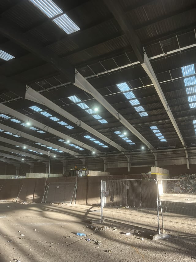 Beam coating in progress inside the recycling hall.