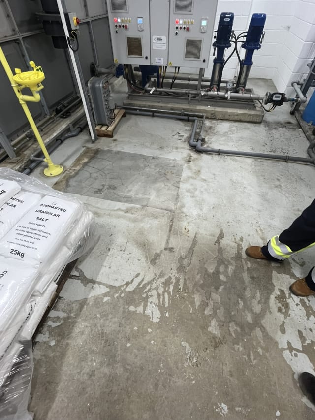 Degraded plant room floor before preparation.