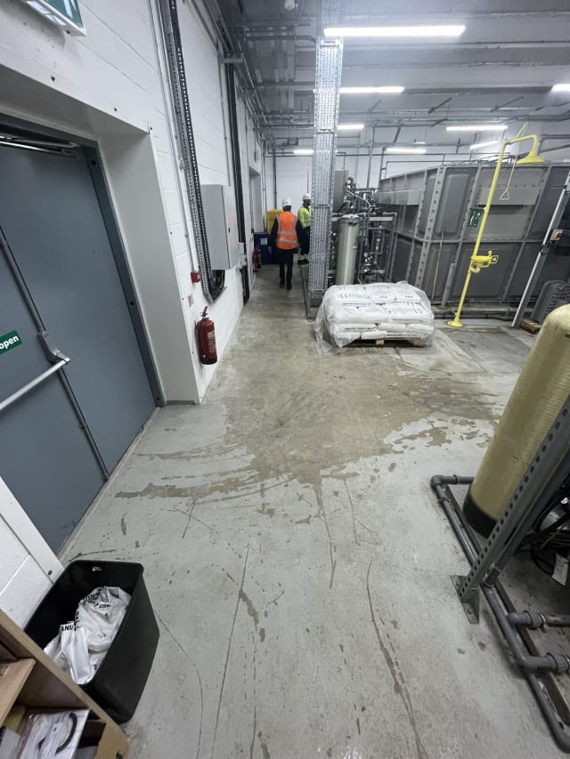 Worn, degraded plant room floor before the works.