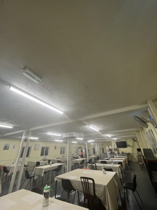 Discoloured kitchen ceiling prior to degreasing.