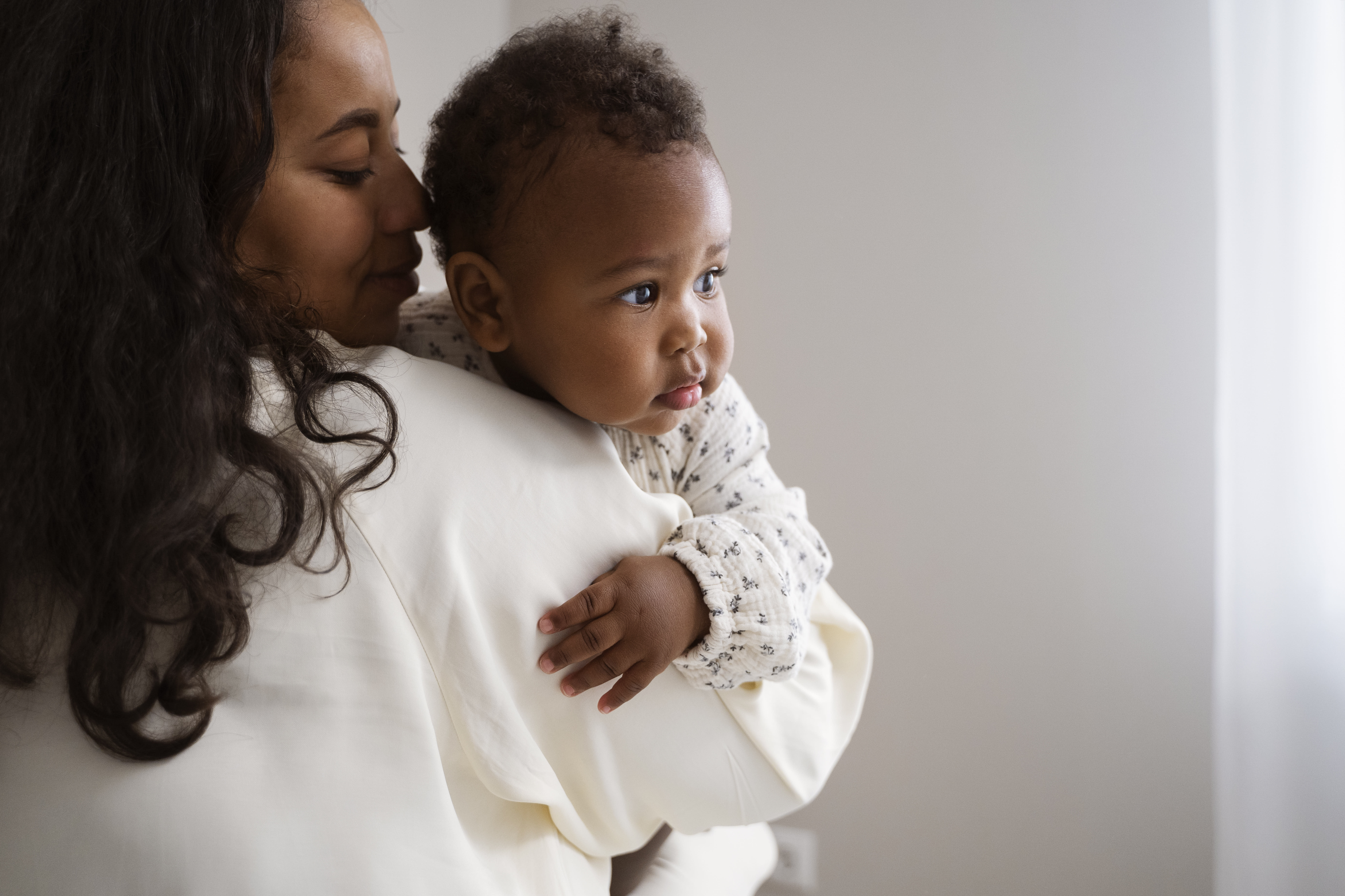 Adorable baby with chubby cheeks demonstrating the cute aggression phenomenon