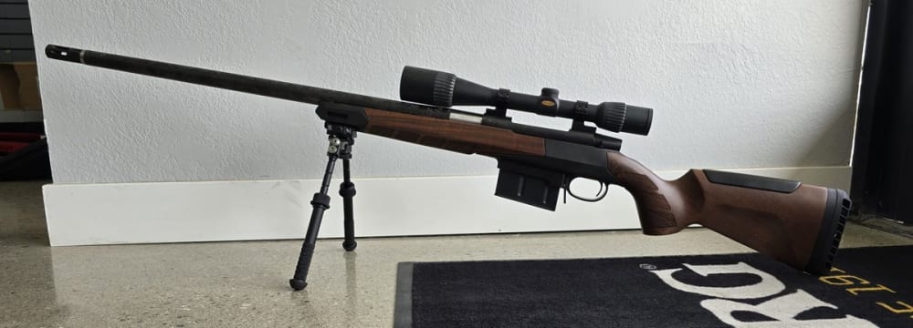 Weatherby Vanguard, .257 Magnum, Bolt Action RIfle, 26" Barrel, Black w/ Woox Wood Stock. Comes with Weaver 4-14x