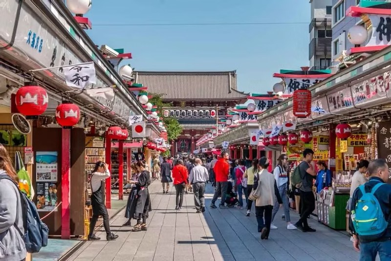 Street in Asakusa with many food stalls and shops