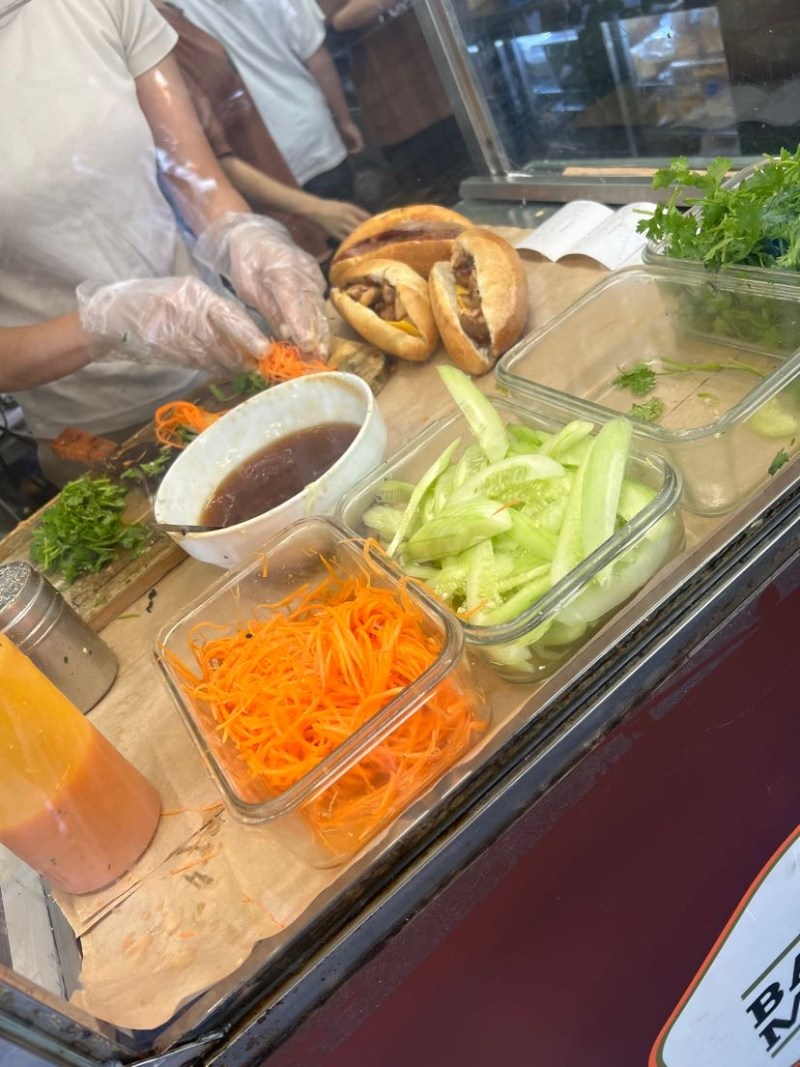 Street-side preparation of banh mi in Hanoi!