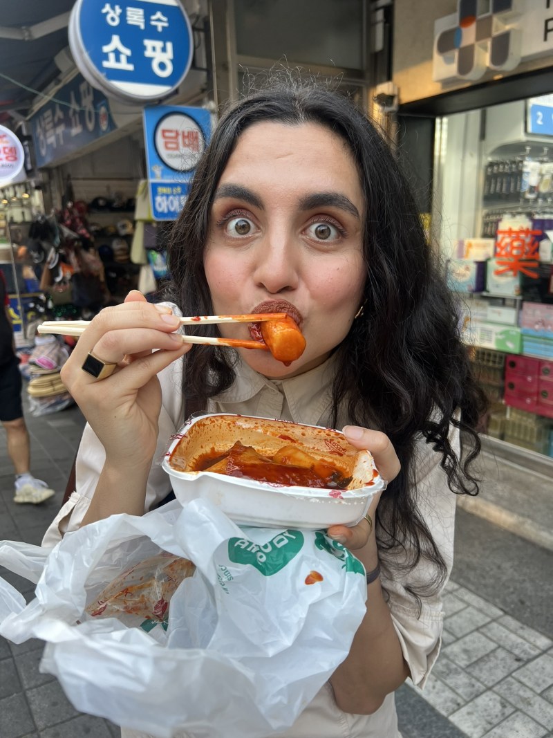 Deeva eating Tteokbokki in Korea