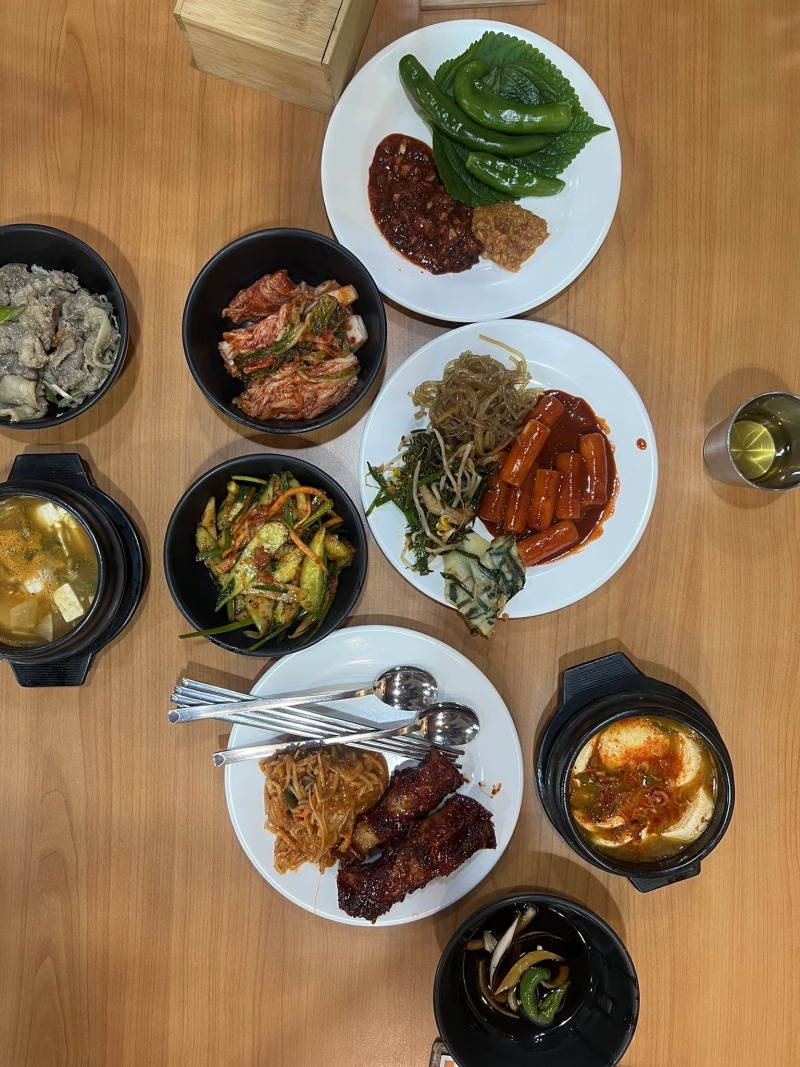 Jiggae along with a variety of Korean side dishes