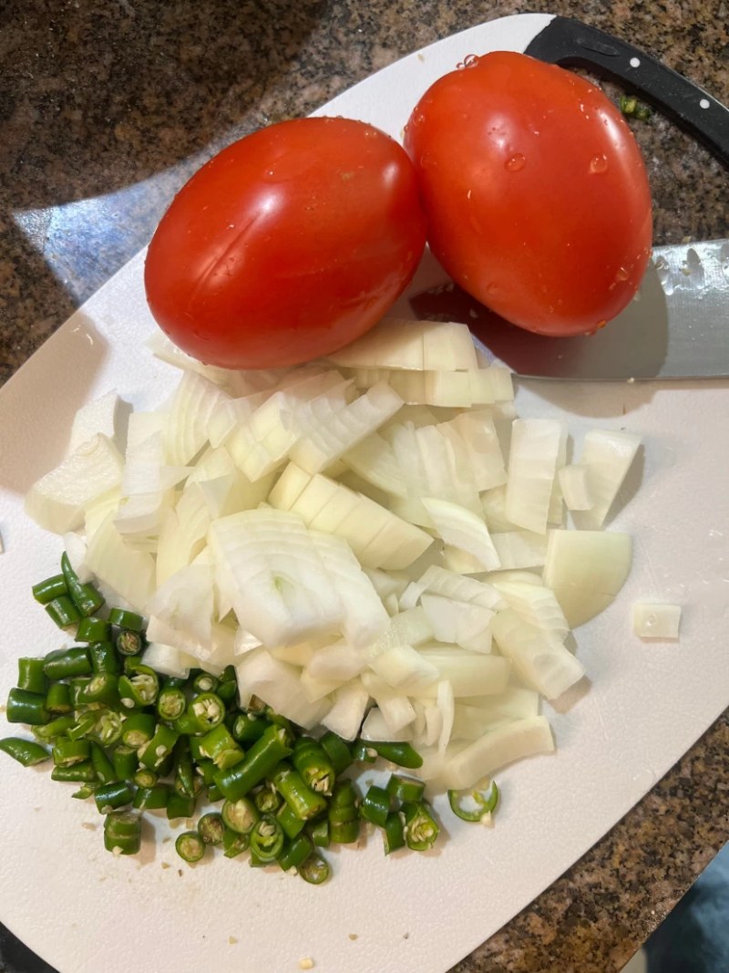 Onions, tomatoes, and green chilies, for making desi eggs
