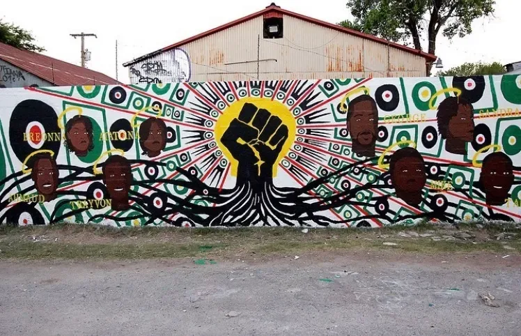 Rooted Resistance: Fist and Faces United Mural in Richardson, TX