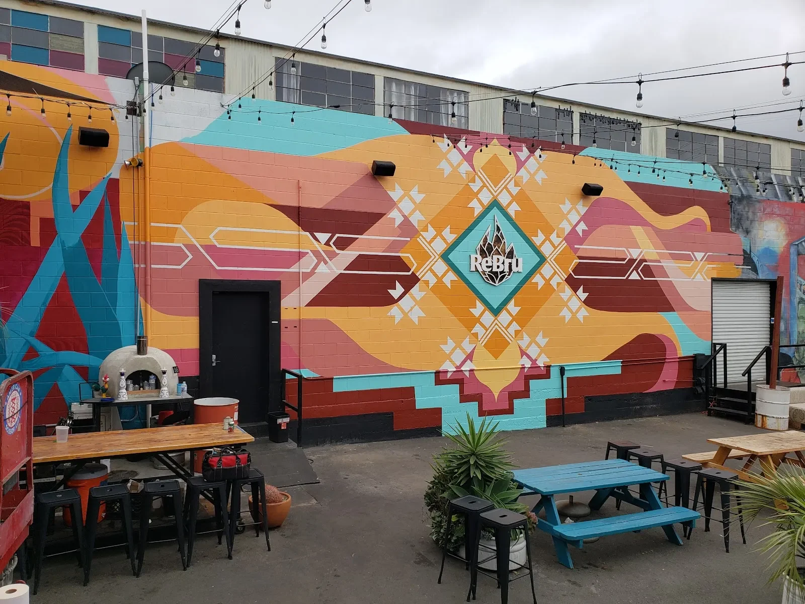 Geometric Sunset Waves with Native American Patterns Mural in Sacramento, CA