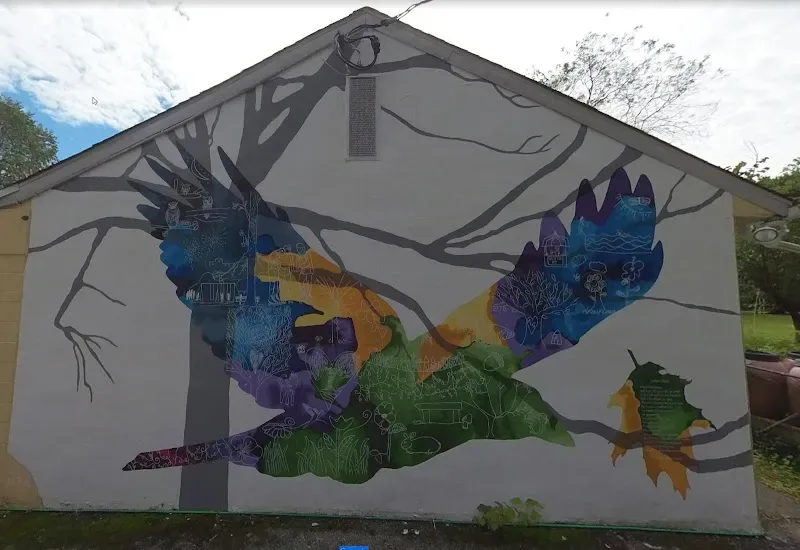Hands Holding Urban Landscape and Nature Mural in Wilmington, DE