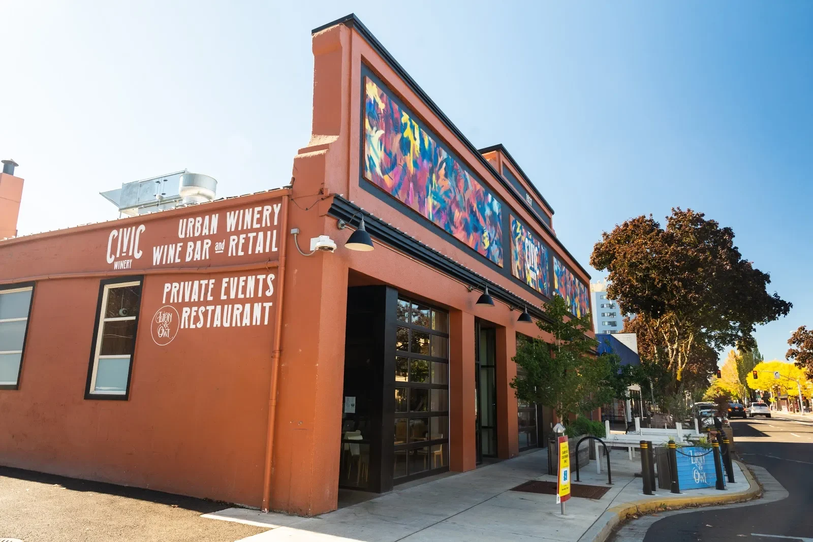 Vibrant Figures in Dynamic Motion Mural in Eugene, OR