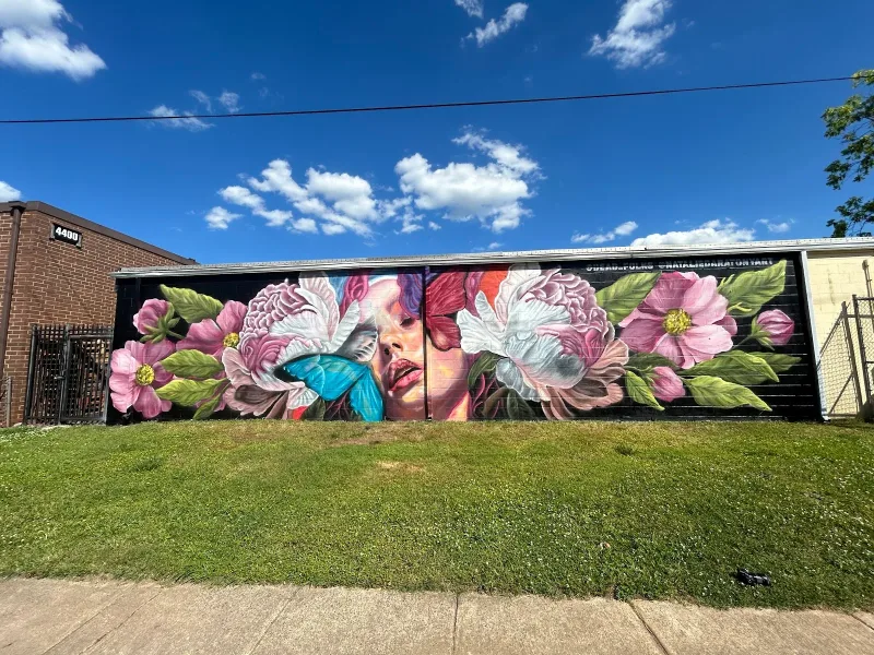 Faces in Bloom with Blue Butterfly Mural in Charlotte, NC in Charlotte
