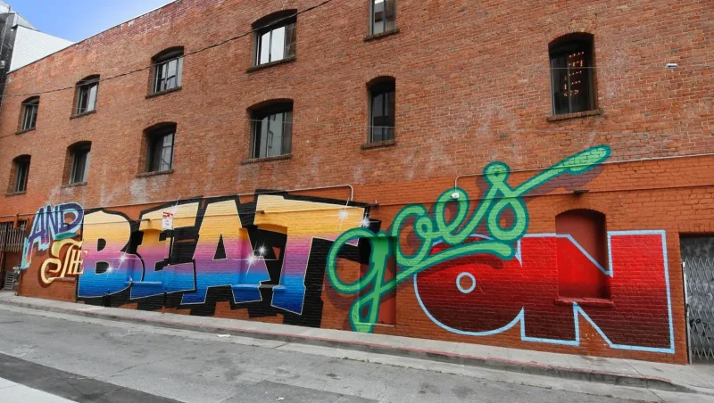 Colorful Graffiti Art with Green Flourishes Mural in San Francisco, CA