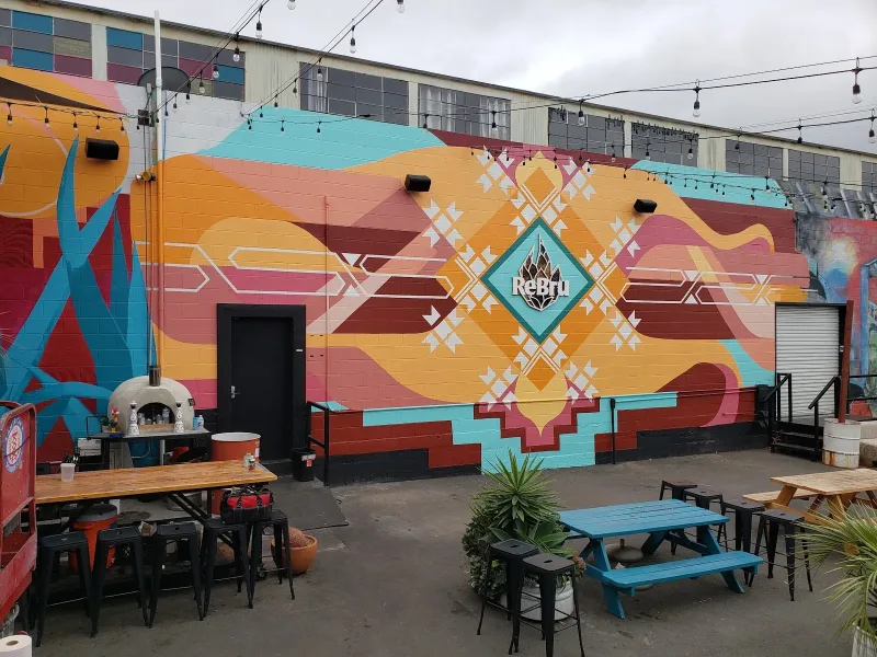 Geometric Sunset Waves with Native American Patterns Mural in Sacramento, CA